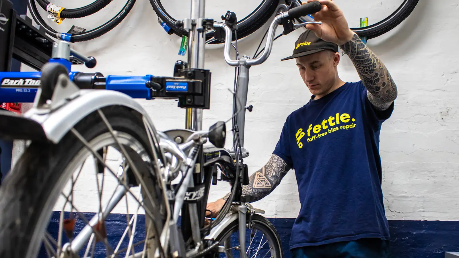 Fettle technician repairing a bike